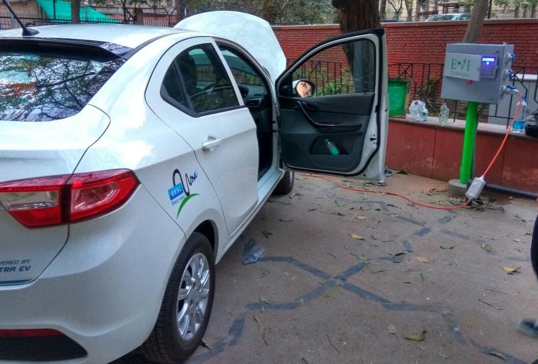 EESL electric car charging from an EVIT charger at a government building, 2017